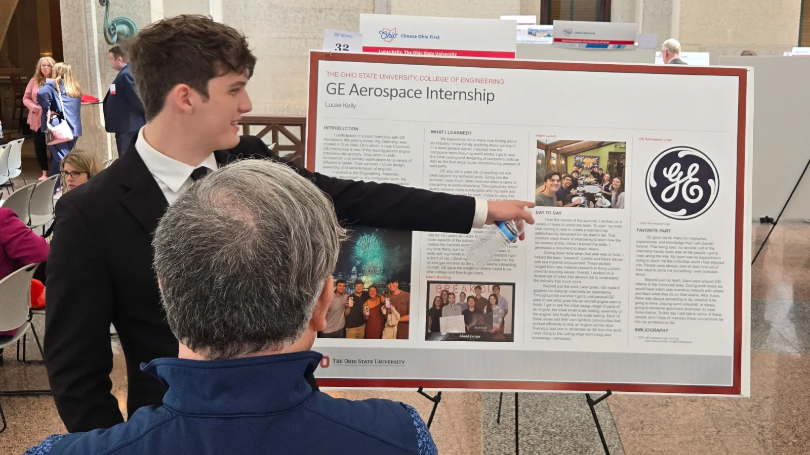 Lucas Kelly delivering a poster presentation