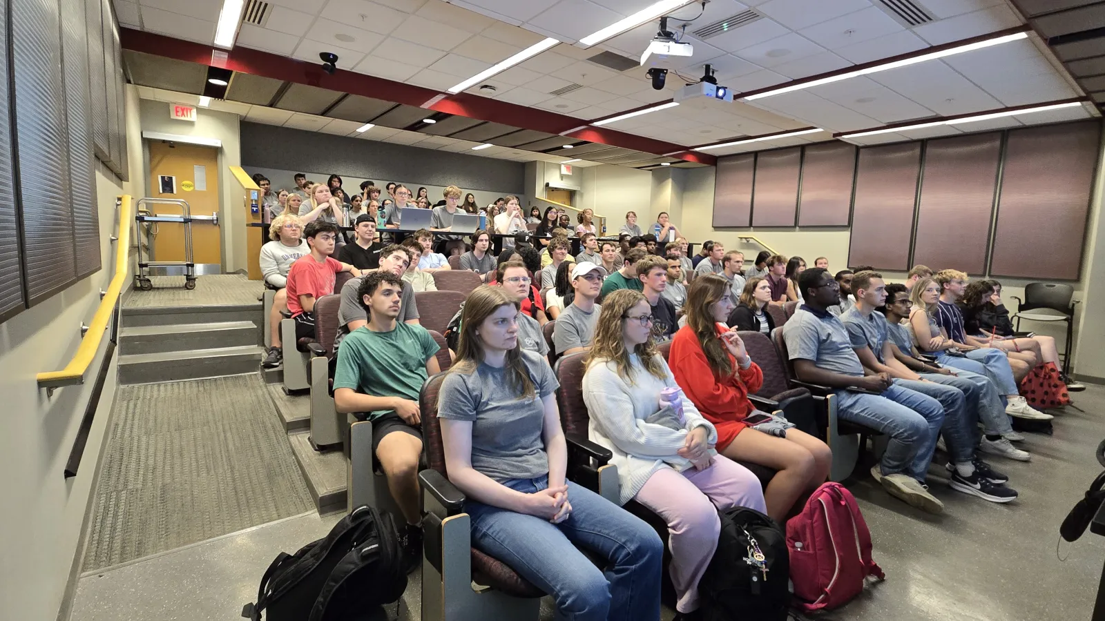COF scholars listening to a presentation, screen not showing up