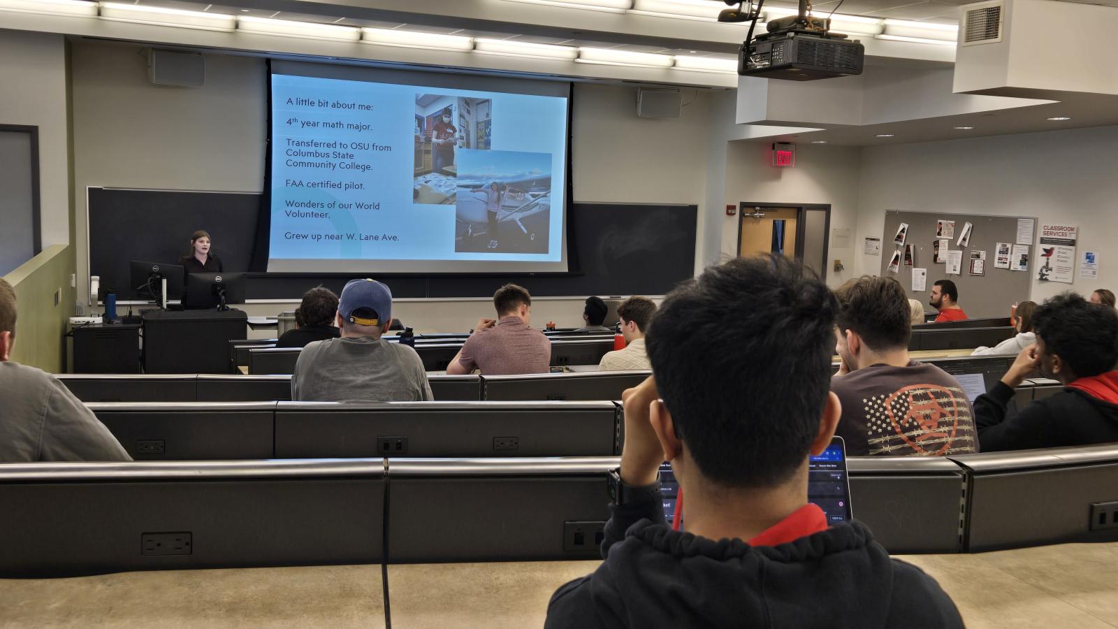 Cherish Brumley delivering a presentation to a group of students